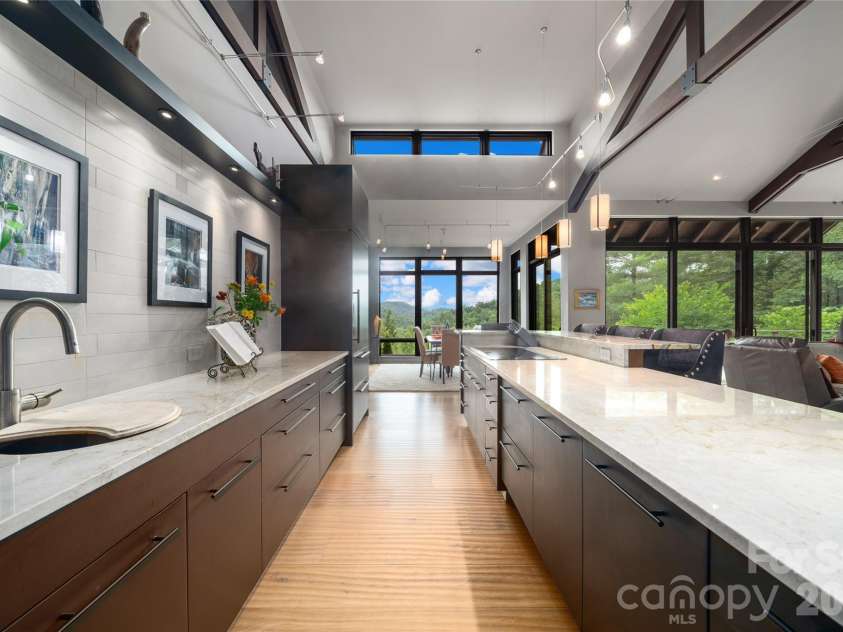 257 Bear Landing Drive, Hendersonville, NC 28792.  MLS# CAR4388350, YatesRealty ID 32963. This chef's kitchen with champagne quartzite countertops and prep sink makes entertaining and family meals easy!