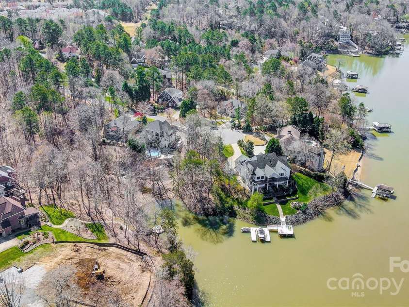 11055 Holiday Cove Road, Tega Cay, SC 29708.  MLS# CAR4320882, YatesRealty ID 3297. Gorgeous waterfront homesite, surrounded by beautiful hardwood trees, on a quiet cul-de-sac, nestled among fine custom waterfront homes in Tega Cay