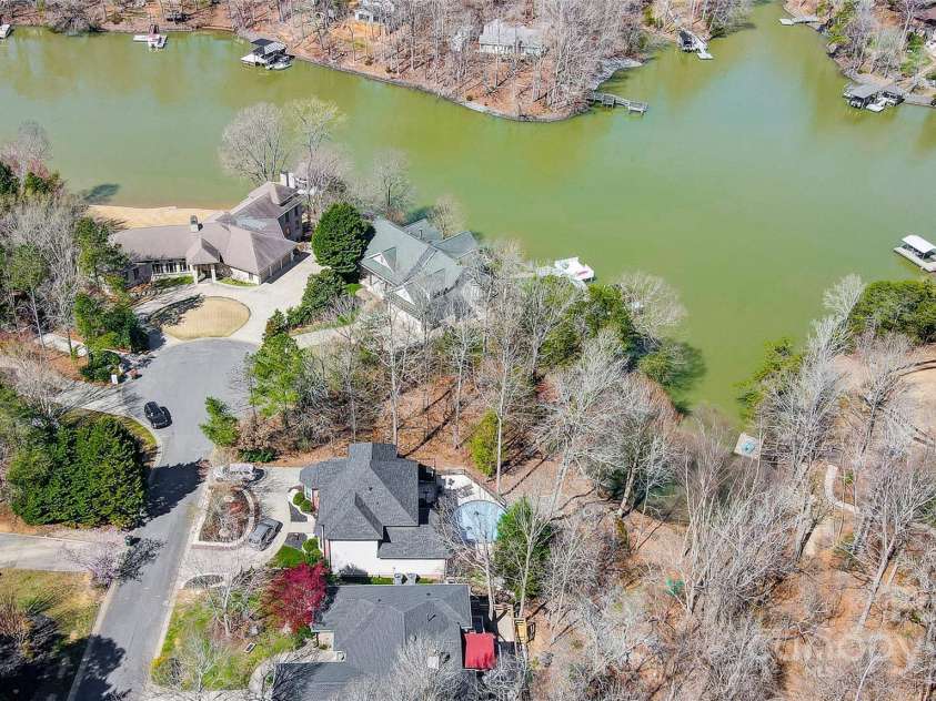 11055 Holiday Cove Road, Tega Cay, SC 29708.  MLS# CAR4320882, YatesRealty ID 3297. Wake up to the gentle sounds of the lake and enjoy the beauty of nature right outside your door