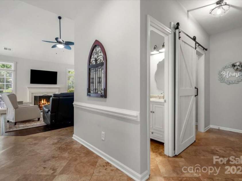 16101 Hollingbourne Road, Huntersville, NC 28078.  MLS# CAR4283282, YatesRealty ID 32979. Hallway to Laundry, Half bath, and the garage