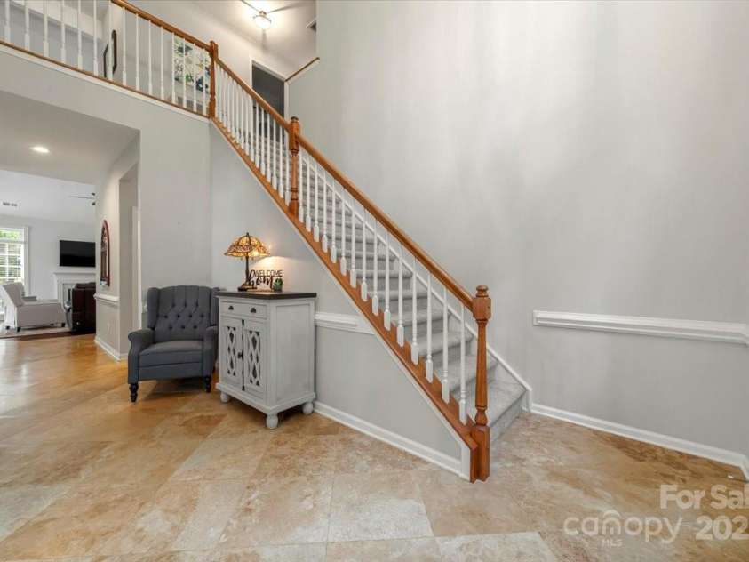 16101 Hollingbourne Road, Huntersville, NC 28078.  MLS# CAR4283282, YatesRealty ID 32979. Two story foyer leading to hallway with half bath and laundry room and the Great room