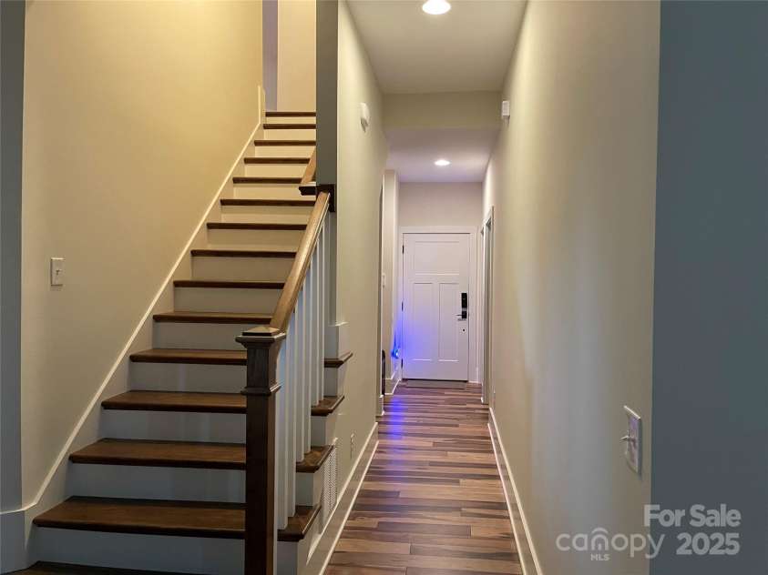 700 Bear Cliff Drive, Nebo, NC 28761.  MLS# CAR4304808, YatesRealty ID 3298. Stairway to 2nd floor/hallway to garage