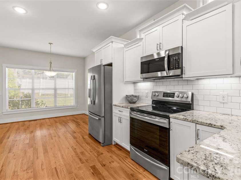 178 Nellwood Court, Mocksville, NC 27028.  MLS# CAR4435808, YatesRealty ID 32981. Beautiful modern kitchen with tile backsplash