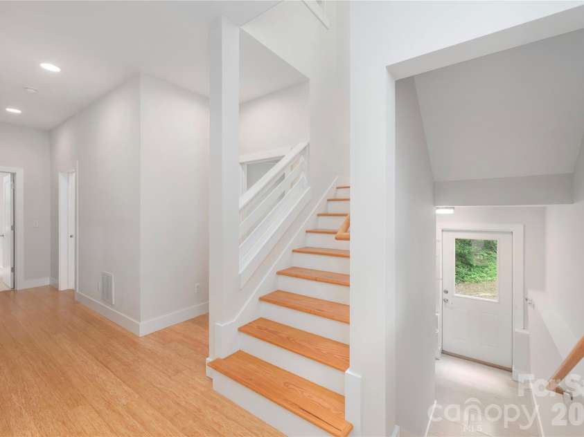 39 Hubbard Avenue, Asheville, NC 28806.  MLS# CAR4391482, YatesRealty ID 32983. Large and light-filled stairs going down to finished lower level.