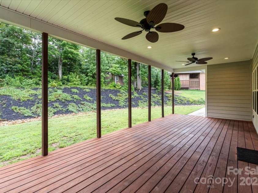 4070 Harmattan Drive, Denver, NC 28037.  MLS# CAR4290373, YatesRealty ID 32991. Picture settling down on the covered back deck