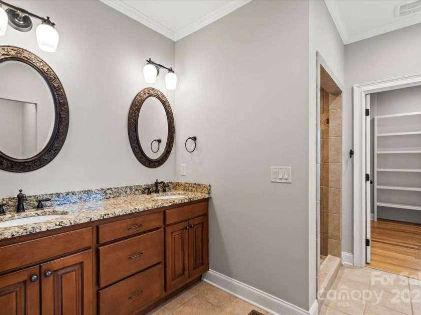 4070 Harmattan Drive, Denver, NC 28037.  MLS# CAR4290373, YatesRealty ID 32991. Primay en suite bathroom features dual vanity sinks and huge walk in shower and large closet