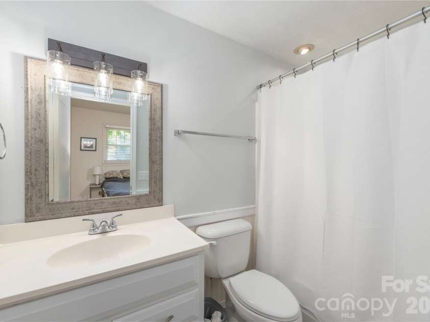 142 Whisperwood Drive, Hendersonville, NC 28791.  MLS# CAR4396470, YatesRealty ID 32997. 