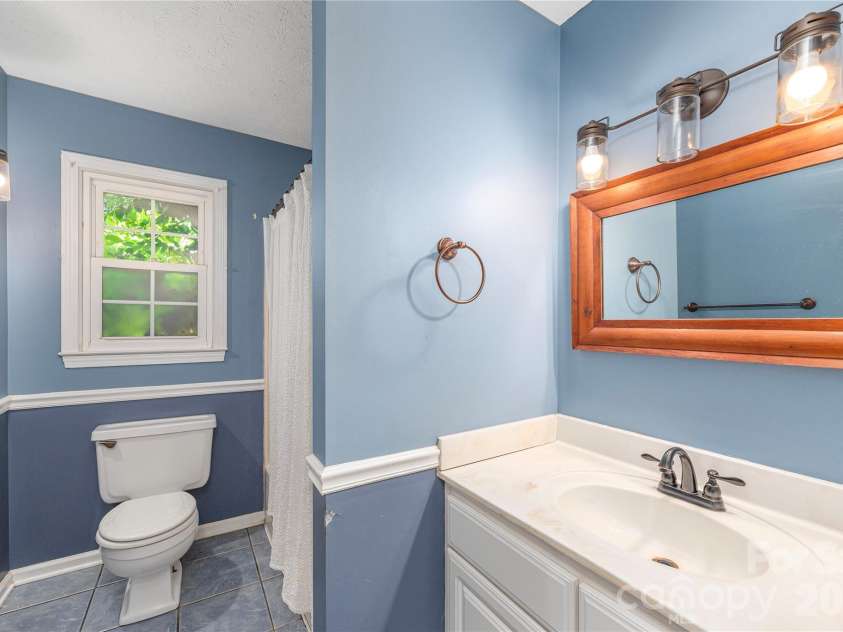 142 Whisperwood Drive, Hendersonville, NC 28791.  MLS# CAR4396470, YatesRealty ID 32997. 