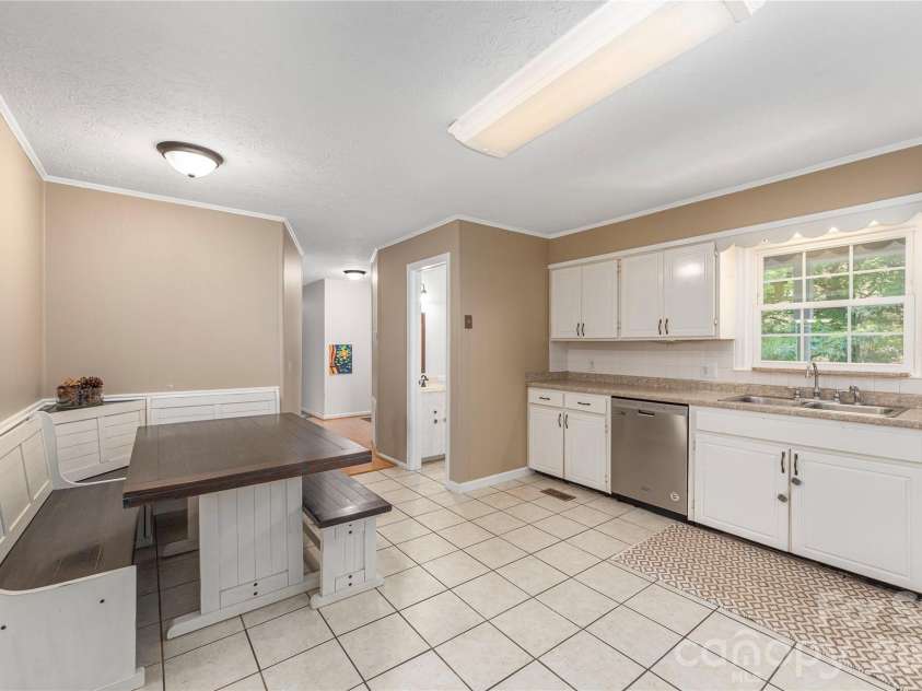 142 Whisperwood Drive, Hendersonville, NC 28791.  MLS# CAR4396470, YatesRealty ID 32997. 