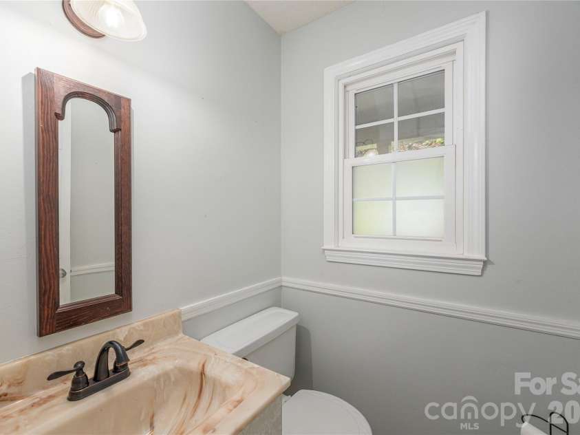 142 Whisperwood Drive, Hendersonville, NC 28791.  MLS# CAR4396470, YatesRealty ID 32997. 