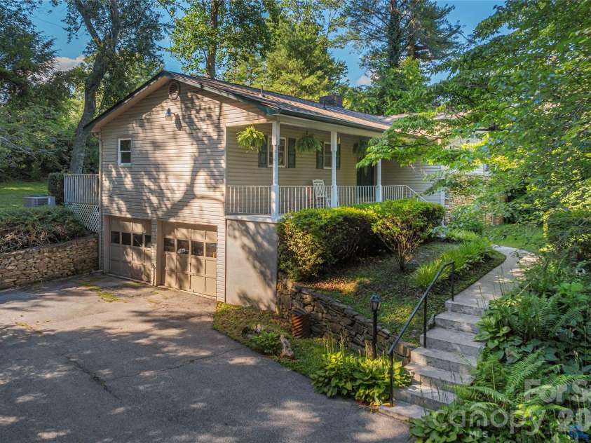 142 Whisperwood Drive, Hendersonville, NC 28791.  MLS# CAR4396470, YatesRealty ID 32997. 