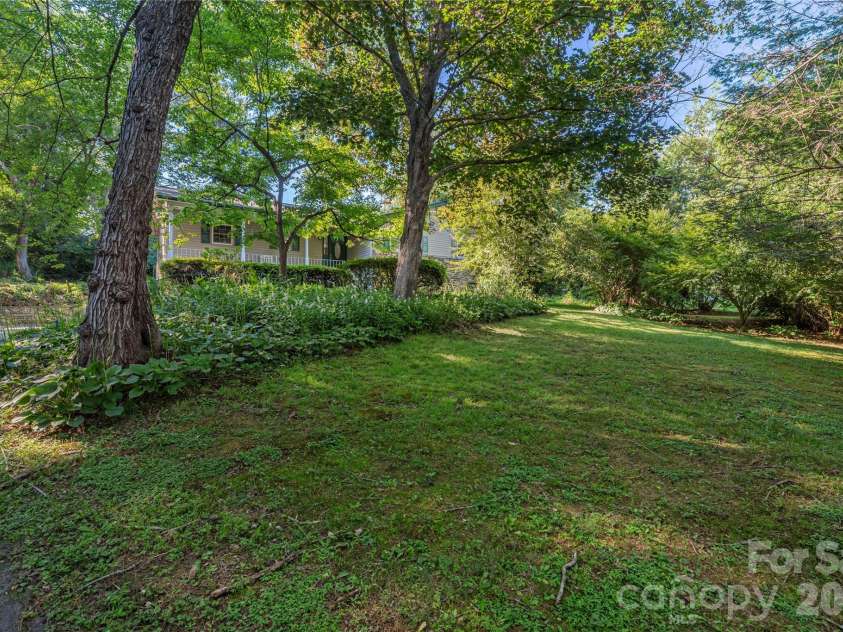 142 Whisperwood Drive, Hendersonville, NC 28791.  MLS# CAR4396470, YatesRealty ID 32997. 