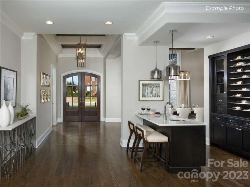 129 Sleepy Cove Trail, Mooresville, NC 28117.  MLS# CAR3936807, YatesRealty ID 33. Foyer and Wine Bar