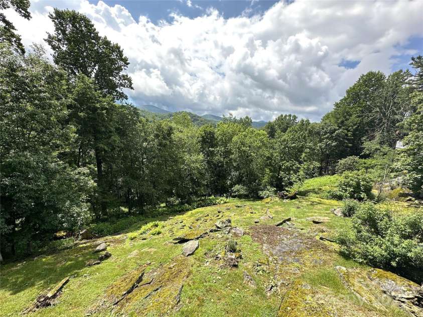 1860 Hickory None, Boone, NC 28607.  MLS# CAR4289793, YatesRealty ID 33006. Unique rock outcroppings in backyard!