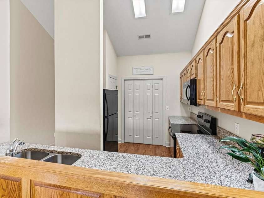 6295 Pansy Trail, Denver, NC 28037.  MLS# CAR4285349, YatesRealty ID 33010. Kitchen open to dinning and living room