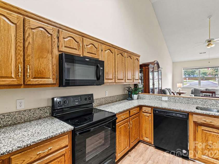 6295 Pansy Trail, Denver, NC 28037.  MLS# CAR4285349, YatesRealty ID 33010. Kitchen with cabinet space galore plus large pantry
