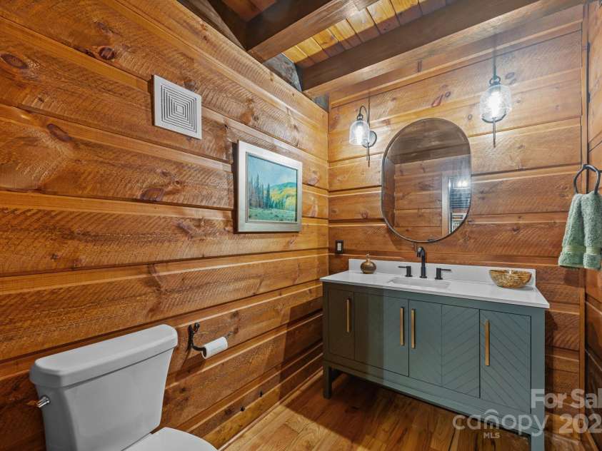 670 Barber Road, Zirconia, NC 28790.  MLS# CAR4293053, YatesRealty ID 33016. Main level half bath