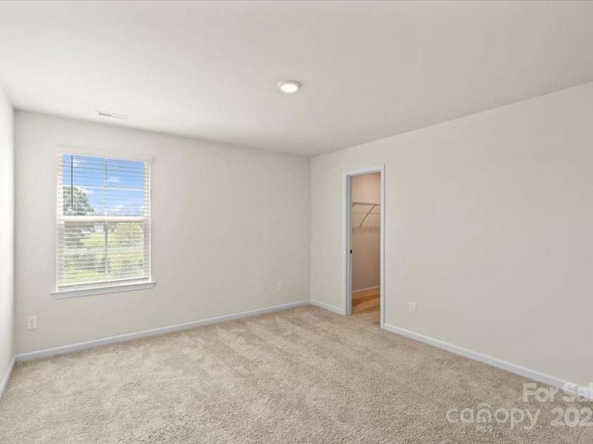 155 Rebecca Avenue, Lexington, NC 27295.  MLS# CAR4284229, YatesRealty ID 33023. Another bedroom in the back of the home with a walk-in closet and private access to the shared full bathroom