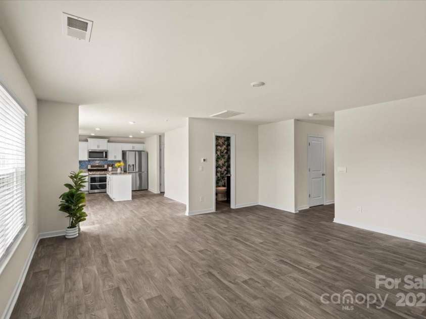 155 Rebecca Avenue, Lexington, NC 27295.  MLS# CAR4284229, YatesRealty ID 33023. The living room flows to the kitchen, with space for a breakfast table or bar