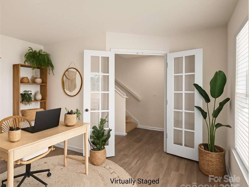155 Rebecca Avenue, Lexington, NC 27295.  MLS# CAR4284229, YatesRealty ID 33023. Virtually staged spacious office; abundant natural light flows through the window looking out the front, with no neighbors across the street