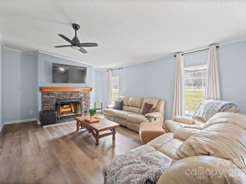 10483 Troutman Road, Midland, NC 28107.  MLS# CAR4285480, YatesRealty ID 33029. Family room with cozy wood burning fireplace is located right off of the Kitchen!