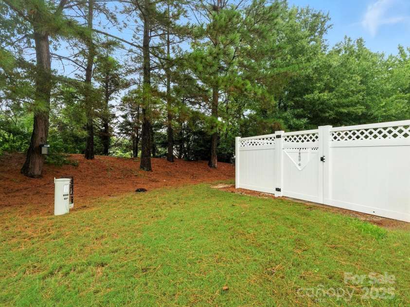 236 Azteca Drive, Matthews, NC 28104.  MLS# CAR4258127, YatesRealty ID 33033. Beyond the Fence