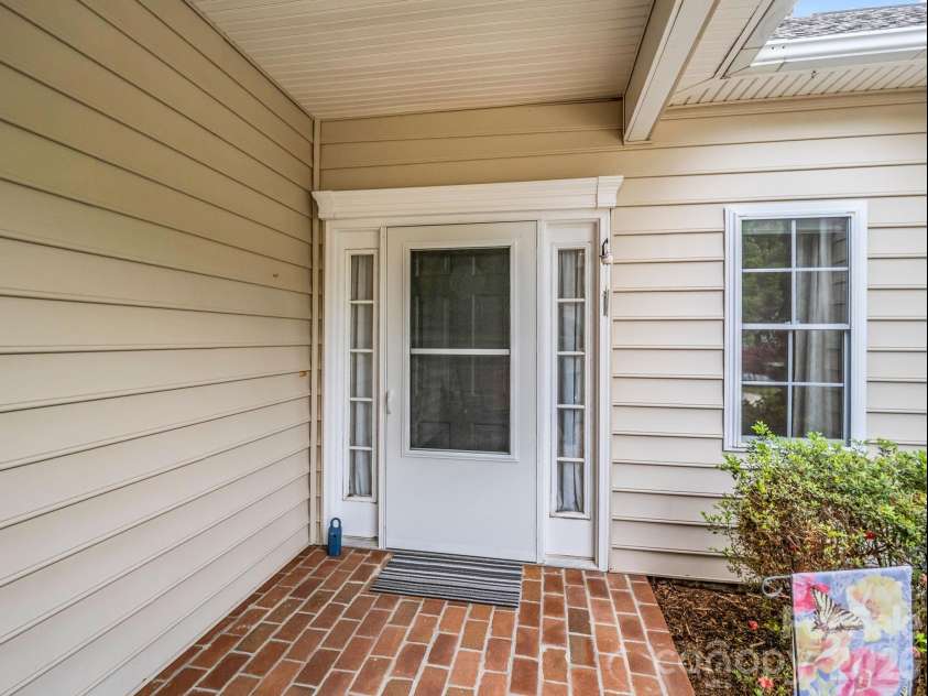 276 Cambridge Drive, Brevard, NC 28712.  MLS# CAR4355184, YatesRealty ID 3304. Front porch