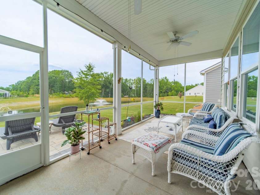 1019 Carlyle Lane, Monroe, NC 28110.  MLS# CAR4395898, YatesRealty ID 33040. Large Lanai overlooking the pond