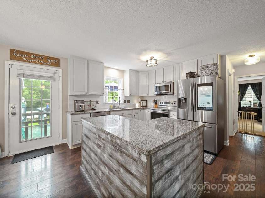 340 Oakview Drive, Salisbury, NC 28146.  MLS# CAR4290519, YatesRealty ID 33043. Kitchen island provides additional prep space