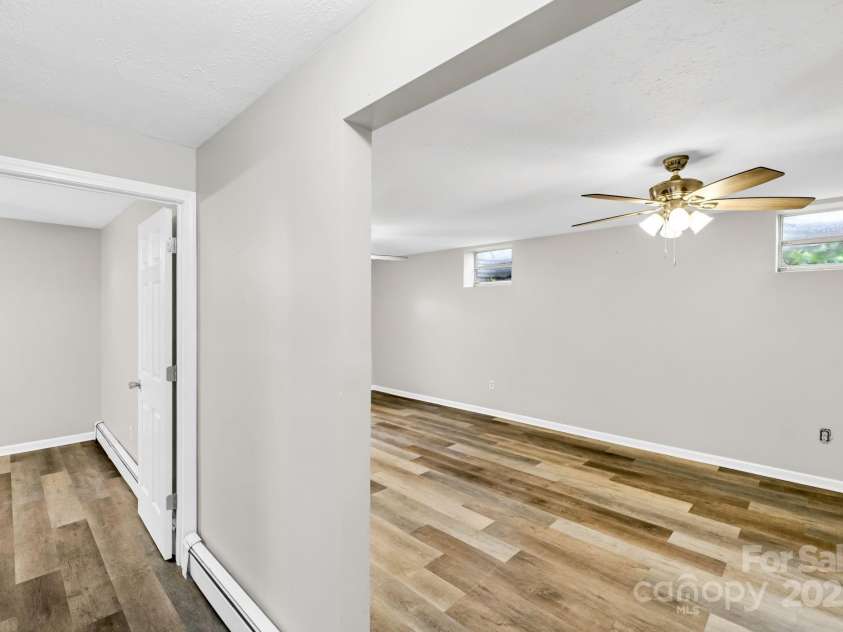 1277 Park Vista Road, West Jefferson, NC 28694.  MLS# CAR4290622, YatesRealty ID 33046. Hallway to den and other room