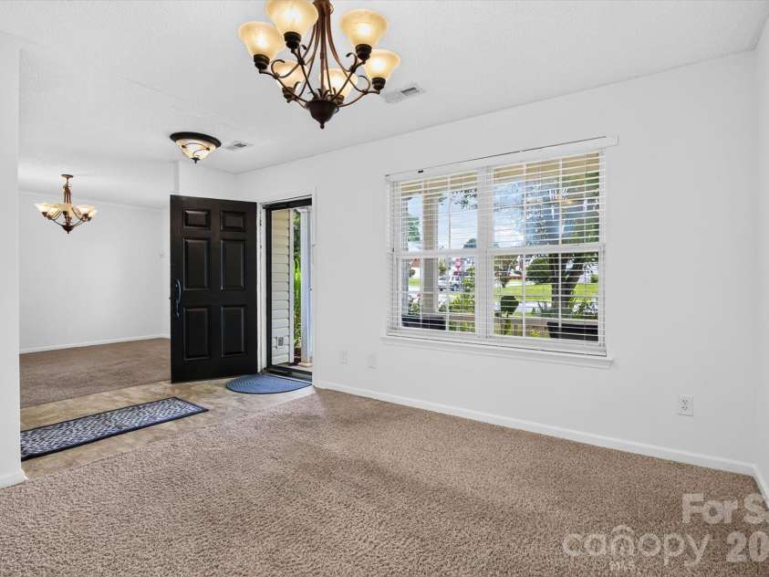 9833 Aventide Lane, Charlotte, NC 28215.  MLS# CAR4377310, YatesRealty ID 33061. Space for formal living and dining rooms