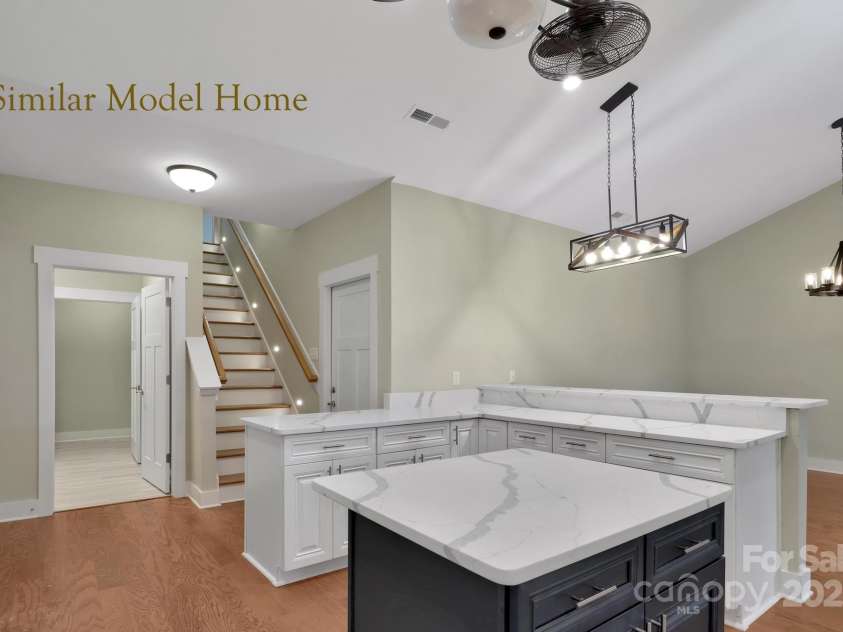 9999-S-3 Brookstone Place, Candler, NC 28715.  MLS# CAR4290047, YatesRealty ID 33063. Convenient kitchen layout with laundry and stairs to bonus suite