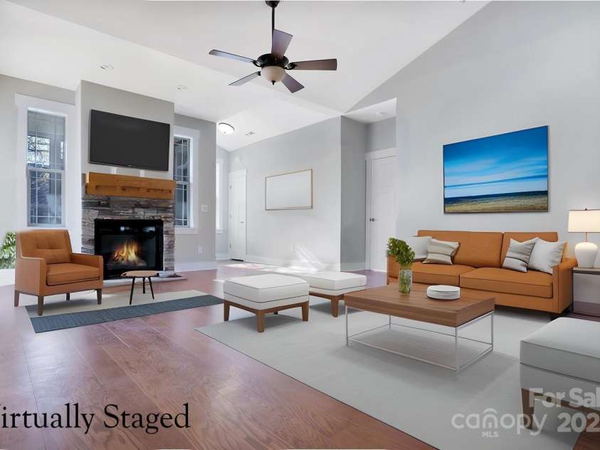 9999-S-3 Brookstone Place, Candler, NC 28715.  MLS# CAR4290047, YatesRealty ID 33063. Open living space with fireplace and dramatic ceilings