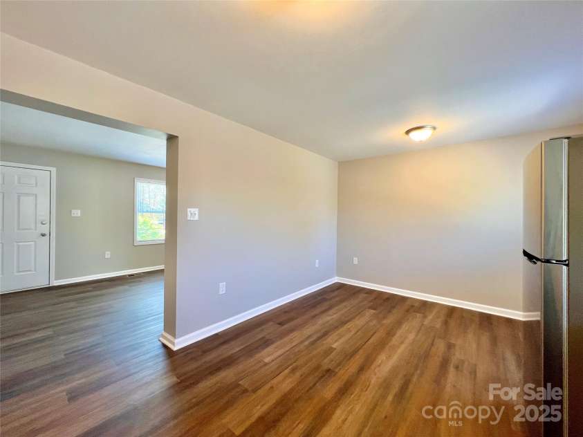 1754 Meadowbrook Terrace, Hendersonville, NC 28791.  MLS# CAR4269491, YatesRealty ID 33067. Typical dining area and living room.