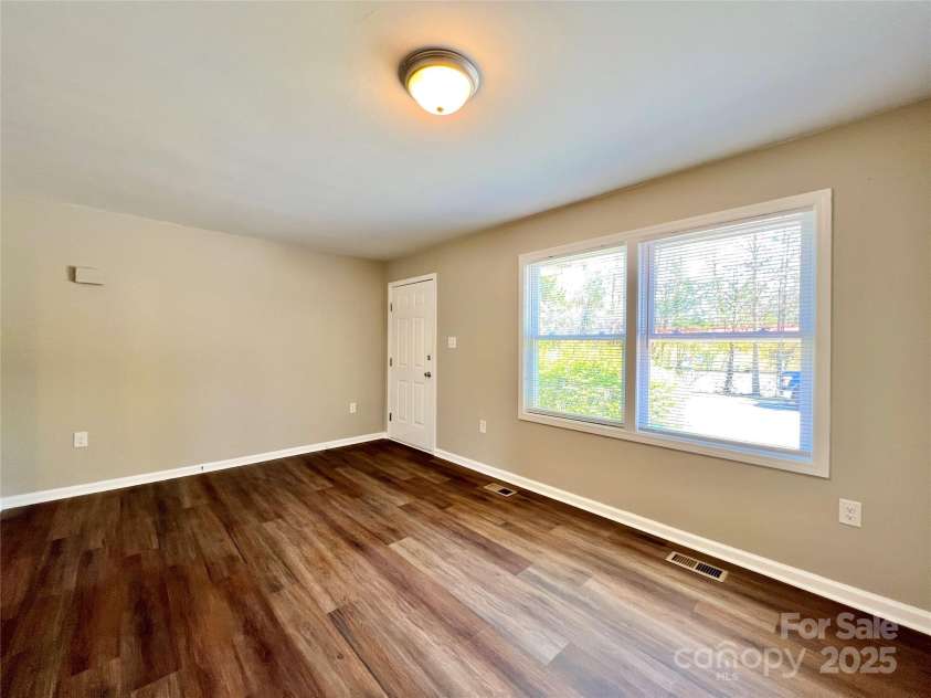 1754 Meadowbrook Terrace, Hendersonville, NC 28791.  MLS# CAR4269491, YatesRealty ID 33067. Typical living room.