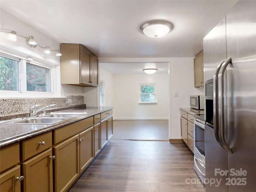120 Harrison Street, Swannanoa, NC 28778.  MLS# CAR4292286, YatesRealty ID 33068. Kitchen opening to dining room