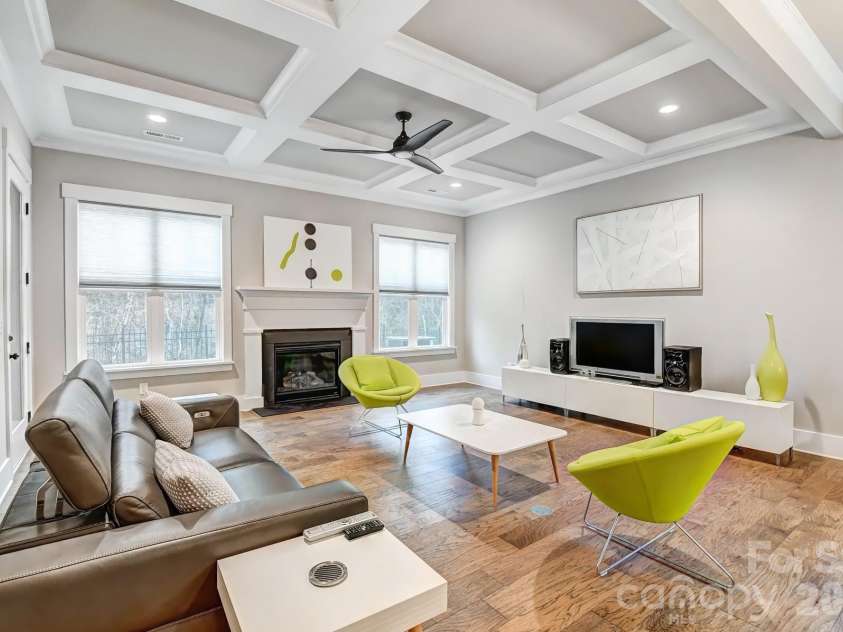 3049 Alveston Drive, Concord, NC 28027.  MLS# CAR4396492, YatesRealty ID 33073. Great Room with coffered ceiling and fireplace.