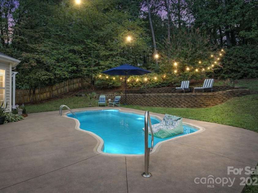 131 Misty Arbor Lane, Mooresville, NC 28117.  MLS# CAR4333134, YatesRealty ID 33085. Back exterior at dusk. *Photo has been virtually enhanced.*