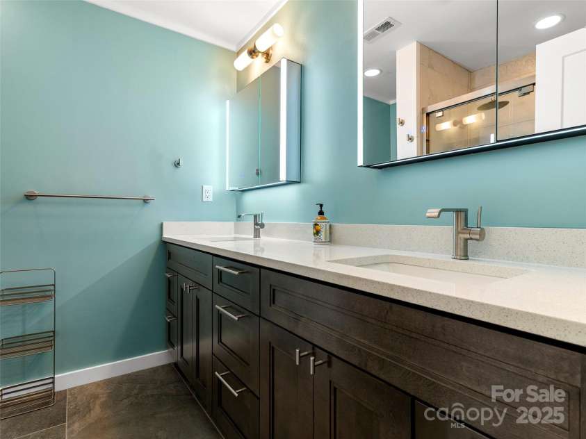 25 Cedarcliff Circle, Asheville, NC 28803.  MLS# CAR4291336, YatesRealty ID 33090. Beautifully updated primary bath
