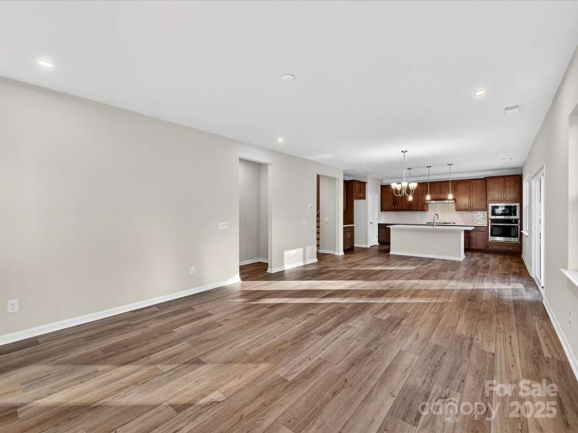 7019 Short Stirrup Lane, Mint Hill, NC 28227.  MLS# CAR4291691, YatesRealty ID 33094. Connected and Seamlessly Blended Living Spaces from Great Room to Kitchen.