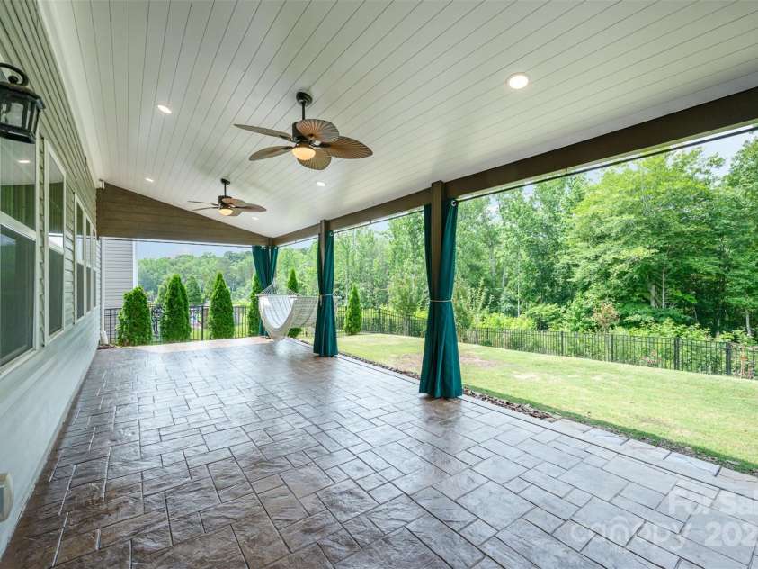 150 Haddonsfield Drive, Mooresville, NC 28115.  MLS# CAR4266211, YatesRealty ID 33097. Amazing covered porch with recessed lights and ceiling fans!