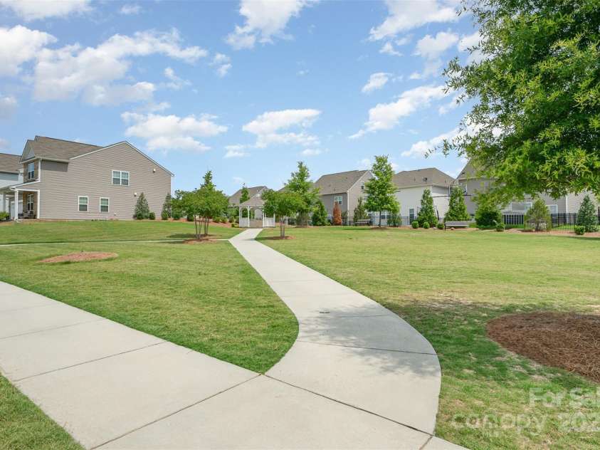 150 Haddonsfield Drive, Mooresville, NC 28115.  MLS# CAR4266211, YatesRealty ID 33097. Common area across with lush lanscaping and gazebo