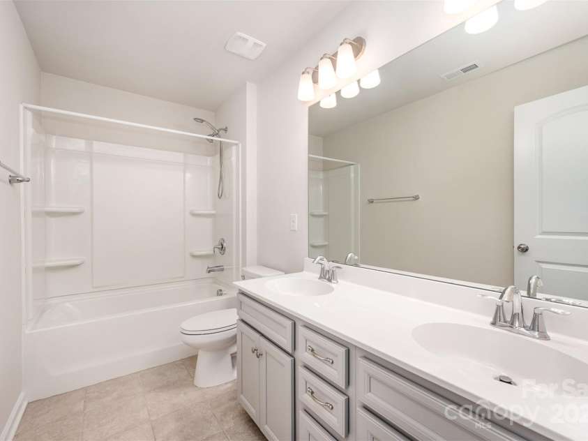 150 Haddonsfield Drive, Mooresville, NC 28115.  MLS# CAR4266211, YatesRealty ID 33097. Hall bath with double vanities.