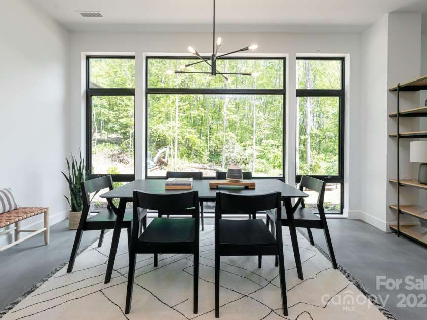 129 English Drive, Candler, NC 28715.  MLS# CAR4255359, YatesRealty ID 33098. Dining Area off Kitchen with Wall of Windows