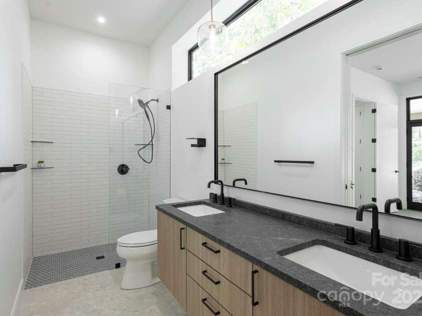 129 English Drive, Candler, NC 28715.  MLS# CAR4255359, YatesRealty ID 33098. Leathered-Granite Double Vanity and Tiled, Zero-Entry Shower