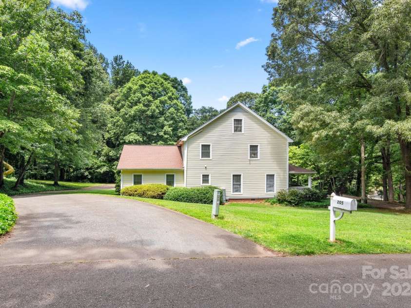 205 Vauxhall Drive, Shelby, NC 28150.  MLS# CAR4131707, YatesRealty ID 331. Side view of home and paved driveway