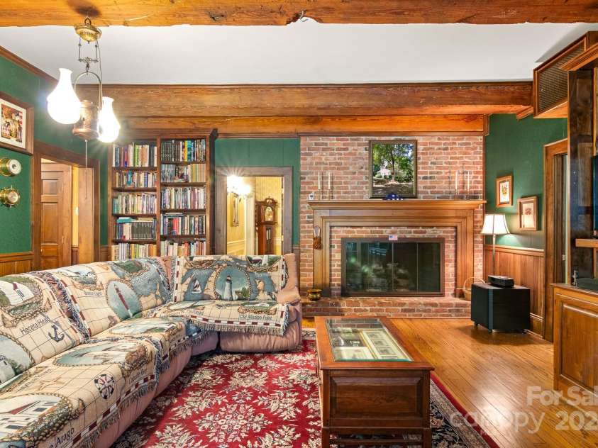 205 Vauxhall Drive, Shelby, NC 28150.  MLS# CAR4131707, YatesRealty ID 331. The den offers a large fireplace with working gas logs and a beautiful built-in bookcase.