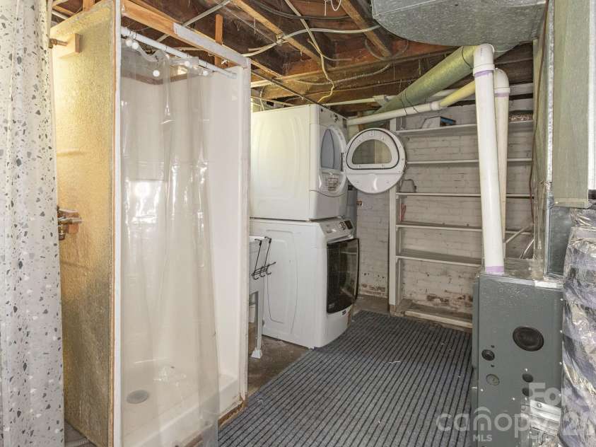 46 Gilkey Street, Marion, NC 28752.  MLS# CAR4396879, YatesRealty ID 33112. Basement laundry area with a bonus shower.