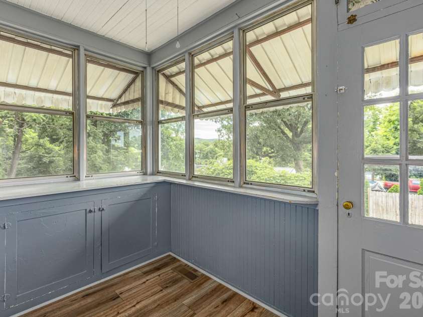 46 Gilkey Street, Marion, NC 28752.  MLS# CAR4396879, YatesRealty ID 33112. Cozy sunroom just off the kitchen.