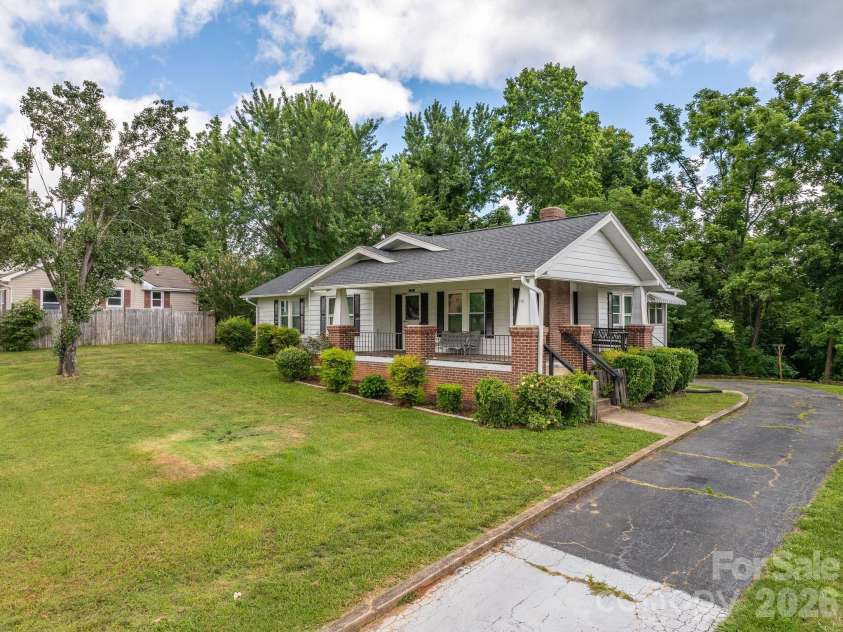 46 Gilkey Street, Marion, NC 28752.  MLS# CAR4396879, YatesRealty ID 33112. Front & right side of home, paved driveway extends behind house.